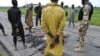 Wasu mayaan Boko Haram/ISWAP da suka mika wuya da makamai (Facebook/Dakarun Najeriya)