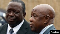 Under pressure: Zimbabwean War Veterans leaders Chris Mutsvangwa (R), annd Victor Matemadanda (L) 