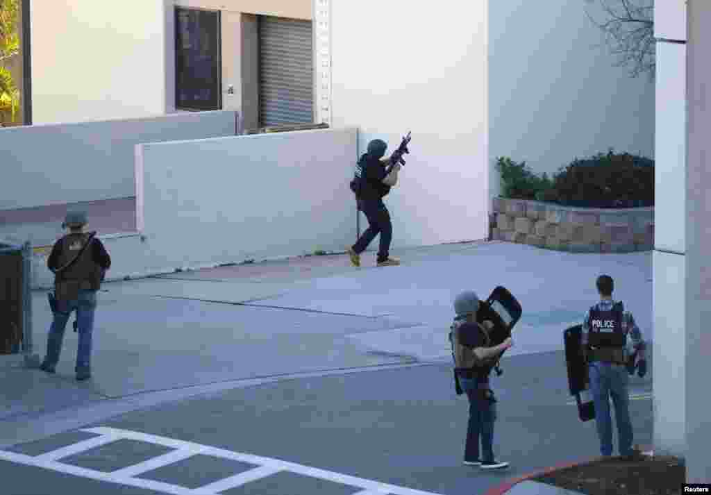 Law enforcement personnel converge on an area near a parking garage adjacent to Building 26 at the Naval Medical Center in San Diego, California.&nbsp;An active shooter situation was reported, according to a post on the medical center&#39;s Facebook page.&nbsp;