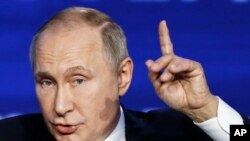 Russian President Vladimir Putin speaks during an annual VTB Capital "Russia Calling!" Investment Forum in Moscow, Russia, Nov. 20, 2019.