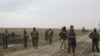 Afghan National Army (ANA) soldiers arrive at the site of last night clashes between Taliban and Afghan forces in Kunduz, Afghanistan, March 4, 2020. 
