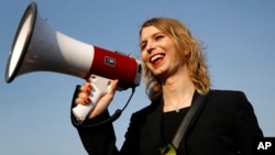 FILE - Chelsea Manning addresses participants at an anti-fracking rally in Baltimore, April 18, 2018. Chelsea Manning, who leaked classified documents, will not be allowed to enter Australia for a speaking tour scheduled to start Sunday.