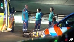 In this image made from video provided by Media TV, personnel respond to a stabbing late Sept. 19, 2024, in the port city of Rotterdam, Netherlands. 