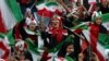 Iranian women cheer during a soccer match between their national team and Cambodia in the 2022 World Cup qualifier at the Azadi (Freedom) Stadium in Tehran, Iran, Oct. 10, 2019. Iranian women were allowed into the stadium for the first time in decades.