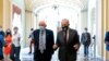 Sen. Bernie Sanders, I-Vt., left, and Senate Majority Leader Chuck Schumer of N.Y., right, speak to members of the media as they walk out of a budget resolution meeting at the Capitol in Washington, Aug. 9, 2021. 