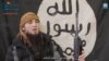 A screenshot depicts a Chechen suicide bomber from a Furat Media propaganda video, released on July 6, distributed by the SITE Intelligence Group.