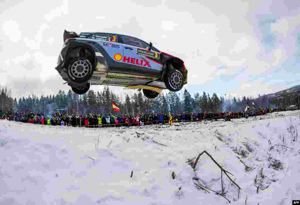 Thierry Neuville of Belgium and his co-driver Nicolas Gilsoul steer their Hyundai i20 WRC during the final stage of the Rally Sweden, second round of the FIA World Rally Championship in Hagfors, Sweden.