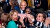 FILE - Maryland Gov. Wes Moore takes a photo with guests at a reception in recognition of Black History Month in the East Room of the White House in Washington, Feb. 6, 2024. 