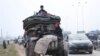 Syrians flee the advance of the government forces in the province of Idlib, Syria, toward the Turkish border, Jan. 29, 2020. 