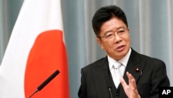 资料照片：现任日本内阁官房长官的加藤胜信在记者会上（2019年9月11日）