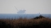 FILE - An Israeli navy boat is seen next to the production platform of Leviathan natural gas field in the Mediterranean Sea near Kibbutz Nahsholim in northern Israel Dec. 18, 2019.