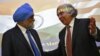 U.S. Energy Secretary Ernest Moniz (R) gestures to Deputy Chairman of India's Planning Commission Montek Singh Ahluwalia after their joint news conference in New Delhi, March 11, 2014. 