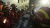 The 19-year-old survivor (C) is carried on a stretcher after being pulled out by rescuers more than 60 hours after a landslide hit an industrial park on Sunday, in Shenzhen, Guangdong province, China, Dec. 23, 2015. 