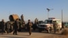 Afghan security force arrive near the site after a suicide bomber blew himself up inside a packed mosque on an Afghan army base in Khost province, Nov. 23, 2018.