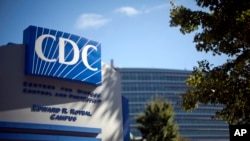 FILE - In this Oct. 8, 2013, file photo, a sign marks the entrance to the federal Centers for Disease Control and Prevention, in Atlanta, Georgia.
