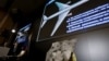 Visuals are displayed during a news conference by Russian arms maker Almaz-Antey at which it presented the results of its probe of last year's downing of Malaysia Airlines flight MH17 over eastern Ukraine, in Moscow, Russia, Oct. 13, 2015. 