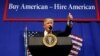 U.S. President Donald Trump speaks before signing an executive order directing federal agencies to recommend changes to a temporary visa program used to bring foreign workers to the United States to fill high-skilled jobs during a visit to the world headq