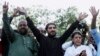 FILE - Manzoor Pashteen, center, leader of the Pashtun Protection Movement waves to his supporters during a rally in Lahore, Pakistan, April 22, 2018.