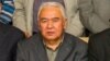 FILE - Nurmuhammad Tohti, sitting at a scholarly gathering in Urumqi, capital of Xinjiang, China. (Abduweli Ayup)