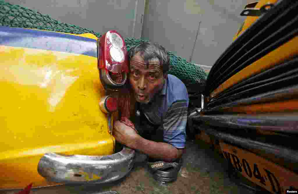 A man is trapped amid construction debris, after a flyover collapsed in Kolkata, India.