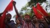 Activists and garment workers shout slogans during a protest demanding a minimum wage of 8,000 Bangladeshi Taka [$100] in Dhaka, Bangladesh, Nov. 8, 2013.
