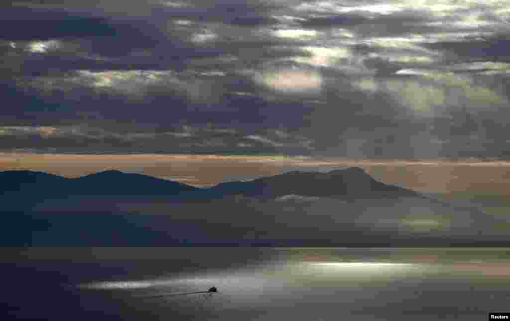 A ferry crosses Lake Geneva near Lausanne, Switzerland, Dec. 16, 2015.