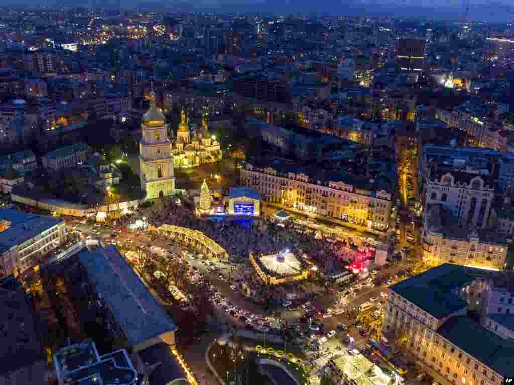 St. Sophia Square is illuminated to mark the upcoming New Year and Orthodox Christmas celebrations in Kyiv, Ukraine.