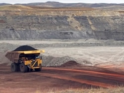 FILE - A dump truck hauls coal at Contura Energy's Eagle Butte Mine near Gillette, Wyo., March 28, 2017. Mine owner Blackjewel says it has filed for Chapter 11 bankruptcy protection. It operates mines in Wyoming, Kentucky, Virginia and West Virginia.