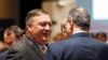 U.S. Secretary of State Mike Pompeo, left, speaks with Russia's Deputy Foreign Minister Igor Morgulov in Singapore, Aug. 4, 2018