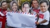 Para demonstran yang tergabung dalam Koalisi Kawal RUU Pilkada mengenakan topeng para kepala daerah yang mendukung Pilkada langsung oleh rakyat, Selasa 16 September 2014 (Foto: VOA/Andylala).