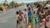 Survivors of Cyclone Idai in a makeshift shelter by the roadside near Nhamatanda about 50 kilometres from Beira, in Mozambique, March, 22, 2019.