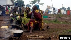Congolese families, who fled from Democratic Republic of, prepare meals at United Nations High Commission for Refugees' (UNHCR) Kyangwali refugee settlement camp, Uganda, Mar. 19, 2018. 