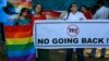 A group of Indian activists hold a banner against section 377 of the Indian Penal Code that criminalizes homosexuality during a protest in Mumbai, India, Dec. 11, 2013.