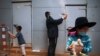 An ultra-Orthodox Jewish man wearing a face mask during a nationwide three-week lockdown to curb the spread of the coronavirus, swings a chicken over his head as part of the Kaparot ritual, in Bnei Brak, Israel, Sept 24, 2020. 