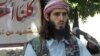 American-born Islamist militant Omar Hammami, 27, speaks during a news conference held by the militant group al-Shabab at a farm in southern Mogadishu's Afgoye district in Somalia. (May 11, 2011 file photo)