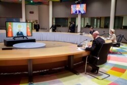 FILE - European Commission President Ursula von der Leyen, right, and European Council President Charles Michel, center, participate in a video meeting with Turkey President Recep Tayyip Erdogan, March 19, 2021