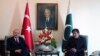 Turkey's President Recep Tayyip Erdogan, left, and Pakistan Prime Minister Imran Khan pose for photos before a meeting, in Islamabad, Pakistan, Feb. 14, 2020.